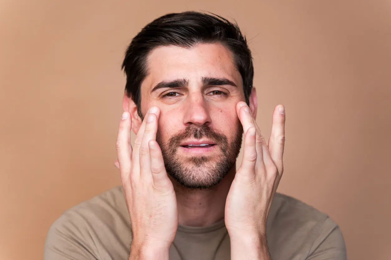 Image of a male patient before and after tear trough filler transformation